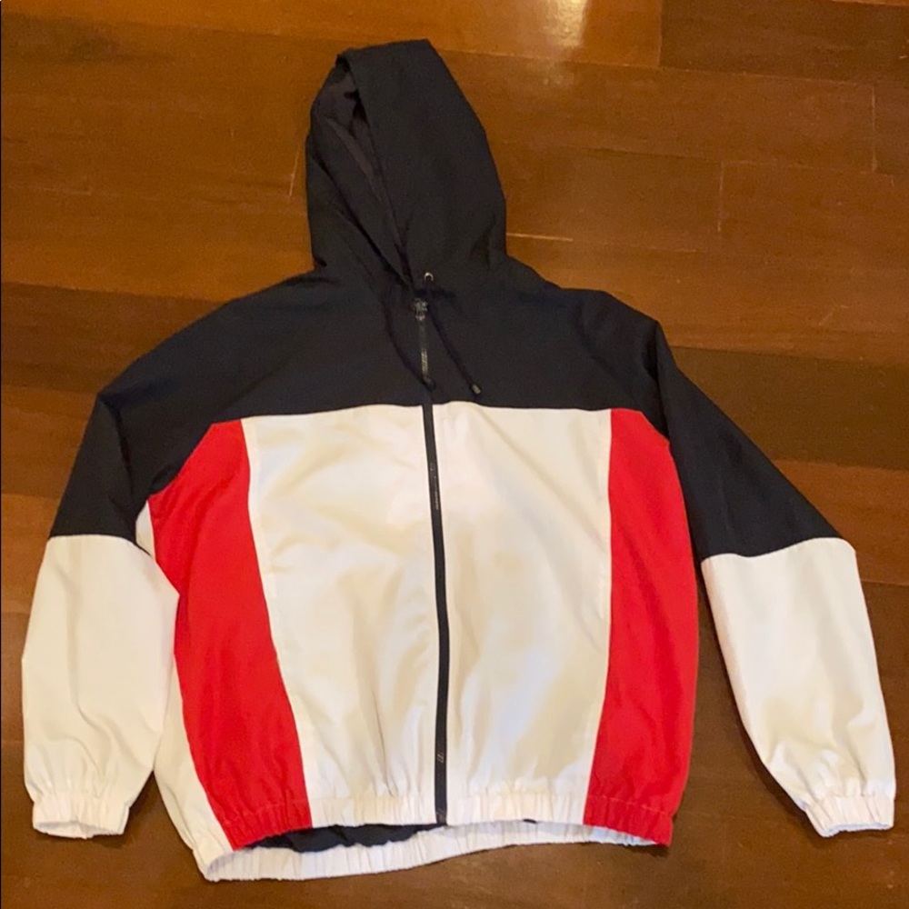 Red, navy, and white zip-up windbreaker